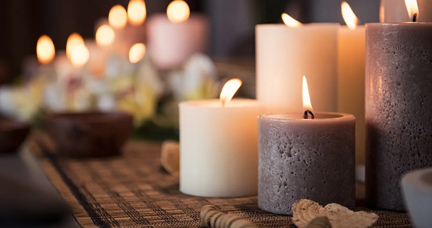 Candle lanterns glowing in warm light, the atmosphere of a group gathering