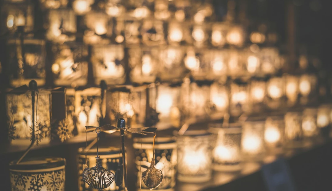 Warm lanterns glowing at dusk, a quiet detail from the studio's surroundings