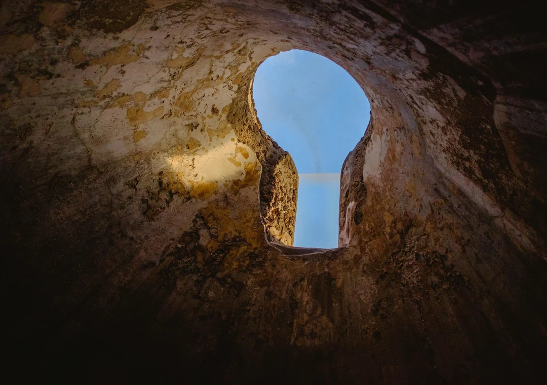 Light falling through a keyhole opening, suggesting a way through